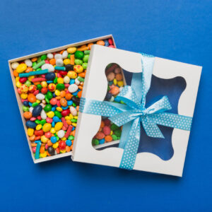 box with sweet chocolate candies on color backgrou 2026 02 01 06 04 49 utc