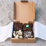 brownies with various topping on cardboard box 2026 01 08 23 38 00 utc