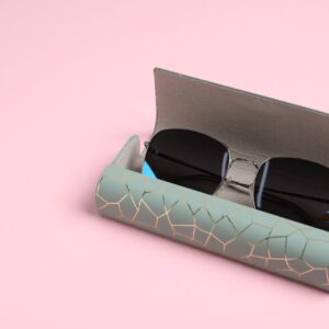 case with stylish sunglasses on light pink backgro 2026 01 11 11 10 19 utc