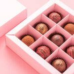 chocolate truffle candies box pink background gif 2026 01 06 10 55 02 utc