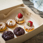 colorful donuts in box 2026 01 08 22 43 44 utc
