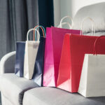 colorful shopping bags on sofa at home 2026 01 08 22 55 21 utc