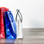 colorful shopping paper bags on a wooden table 2026 01 07 07 15 12 utc
