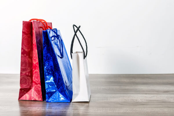 colorful shopping paper bags on a wooden table 2026 01 07 07 15 12 utc