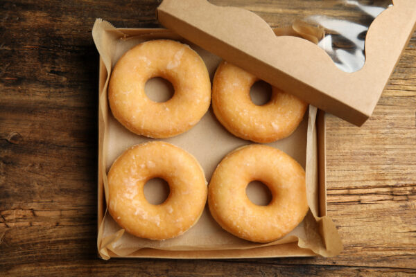 delicious donuts on wooden table top view 2026 01 05 20 29 04 utc