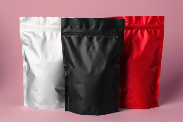 different blank foil packages on pink background 2026 01 26 20 00 45 utc