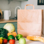 eco shopping paper bag with fresh vegetables and b 2026 01 06 00 49 57 utc