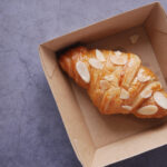 fresh baked croissant in a bow on table 2026 01 06 10 21 53 utc