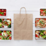 healthy food take away in boxes top view at wood 2026 01 08 23 25 27 utc