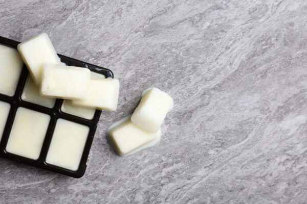 ice cubes made with milk and tray on grey backgrou 2026 02 24 23 45 31 utc