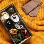 organizer with different socks on orange blanket 2026 01 11 11 11 03 utc