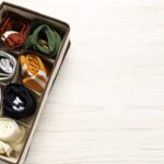 organizer with different socks on wooden table to 2026 01 11 11 11 03 utc