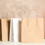 paper bags on white table against brown background 2026 01 09 07 28 16 utc