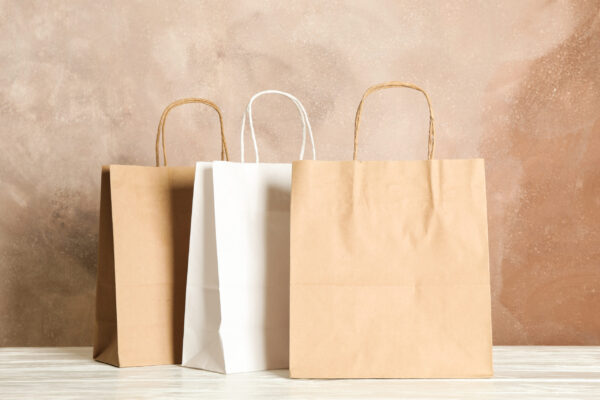paper bags on white table against brown background 2026 01 09 07 28 16 utc