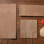 paper eco bags with fresh vegetables on wooden bac 2026 01 11 09 31 58 utc