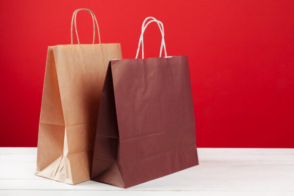 several shopping bags with copy space on red backg 2026 01 08 06 05 01 utc