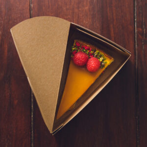 top view of a mango cheesecake with raspberries in 2026 01 07 07 16 22 utc