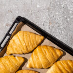top view of baked delicious croissants on baking t 2026 01 06 00 43 57 utc