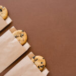 top view of cookies in craft packages on brown bac 2026 01 05 23 40 28 utc