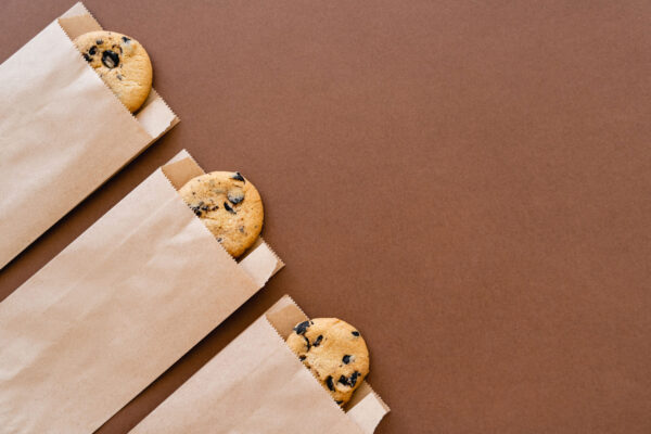 top view of cookies in craft packages on brown bac 2026 01 05 23 40 28 utc