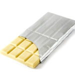 white chocolate bar emerging from silver foil on w 2026 01 09 10 42 47 utc