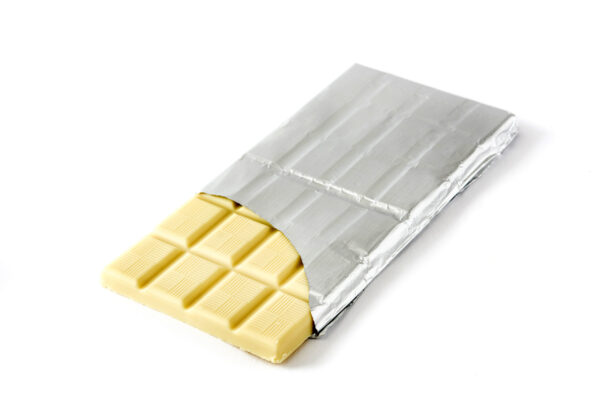white chocolate bar emerging from silver foil on w 2026 01 09 10 42 47 utc