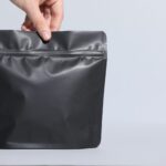 woman holding blank zipper stand up pouch on light 2026 01 11 10 52 25 utc