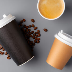 a black coffee cup surrounded by roasted coffee be 2026 01 08 22 44 02 utc