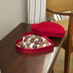 a heartshaped box of chocolates on a wooden table 2026 01 09 11 06 53 utc
