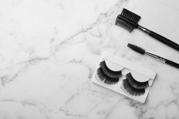 artificial eyelashes and accessories on marble bac 2026 03 08 23 04 36 utc