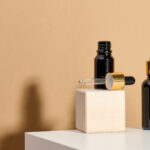 brown glass bottle with pipette stands on a white 2026 01 09 07 00 17 utc