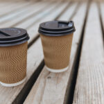 brown ripple paper cups of hot aroma coffee with b 2026 01 07 05 34 02 utc