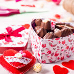 chokolate box in shape of heart on white wooden ta 2026 01 07 01 38 30 utc
