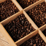 coffee beans in wooden box dark roast caffeine a 2026 01 05 23 40 00 utc
