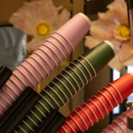 colorful disposable coffee cups stacked in holder 2026 01 11 10 12 01 utc