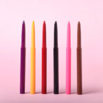 colorful twist up eye pencils on pink background 2026 03 11 04 23 49 utc