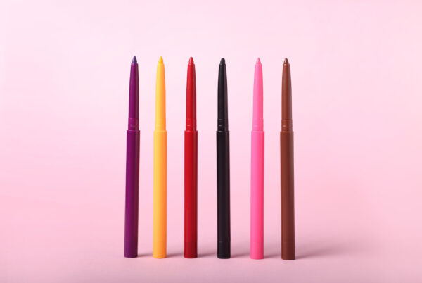 colorful twist up eye pencils on pink background 2026 03 11 04 23 49 utc