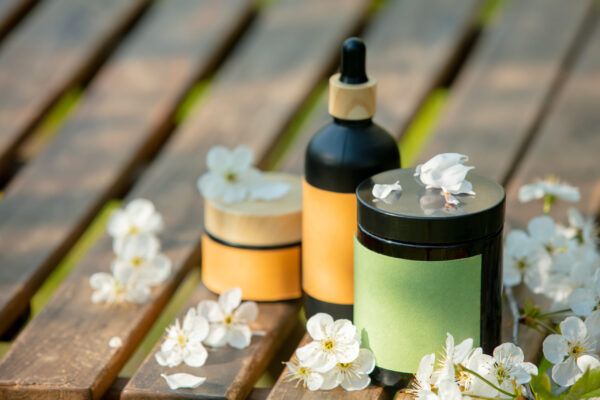cosmetic jar on wooden table in blooming tree spri 2026 01 05 04 45 53 utc