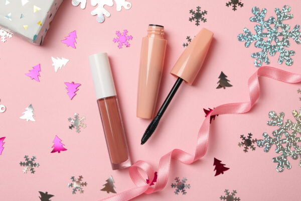 cosmetics and christmas accessories on pink backgr 2026 03 24 22 22 58 utc