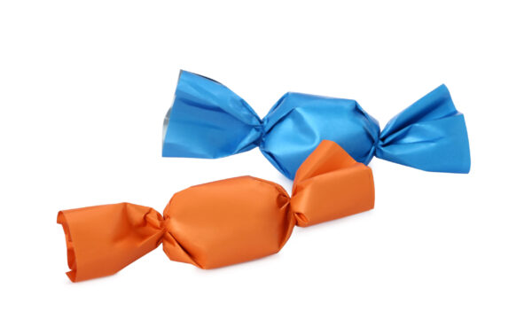 delicious candies in colorful wrappers on white ba 2026 02 19 19 43 19 utc