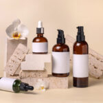 glass cosmetic bottles near white orchid flowers a 2026 03 24 00 30 05 utc