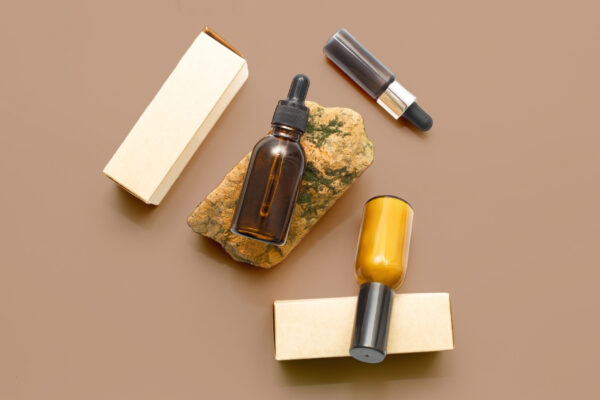 glass cosmetic bottles with a dropper on a beige b 2026 01 06 09 13 59 utc
