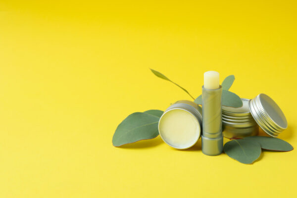 hygienic lipstick and lip balm on yellow backgroun 2026 03 24 23 11 58 utc