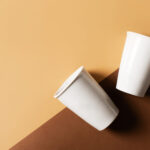 mug or cup of coffe to go porcelain on brown backg 2026 03 17 08 59 13 utc