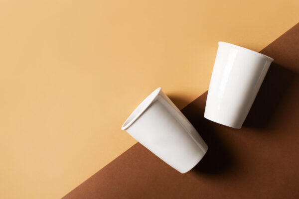 mug or cup of coffe to go porcelain on brown backg 2026 03 17 08 59 13 utc