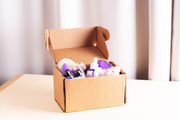 open cardboard beauty box with body care and skin 2026 03 09 03 24 19 utc