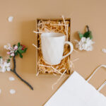 open gift box with peach colored paper shavings co 2026 03 24 07 08 40 utc