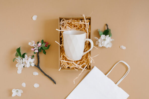 open gift box with peach colored paper shavings co 2026 03 24 07 08 40 utc