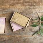 packed handmade soap bars and olive twig on wooden 2026 03 05 11 45 47 utc