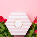 pink roses and gift box top view 2026 03 19 03 58 11 utc